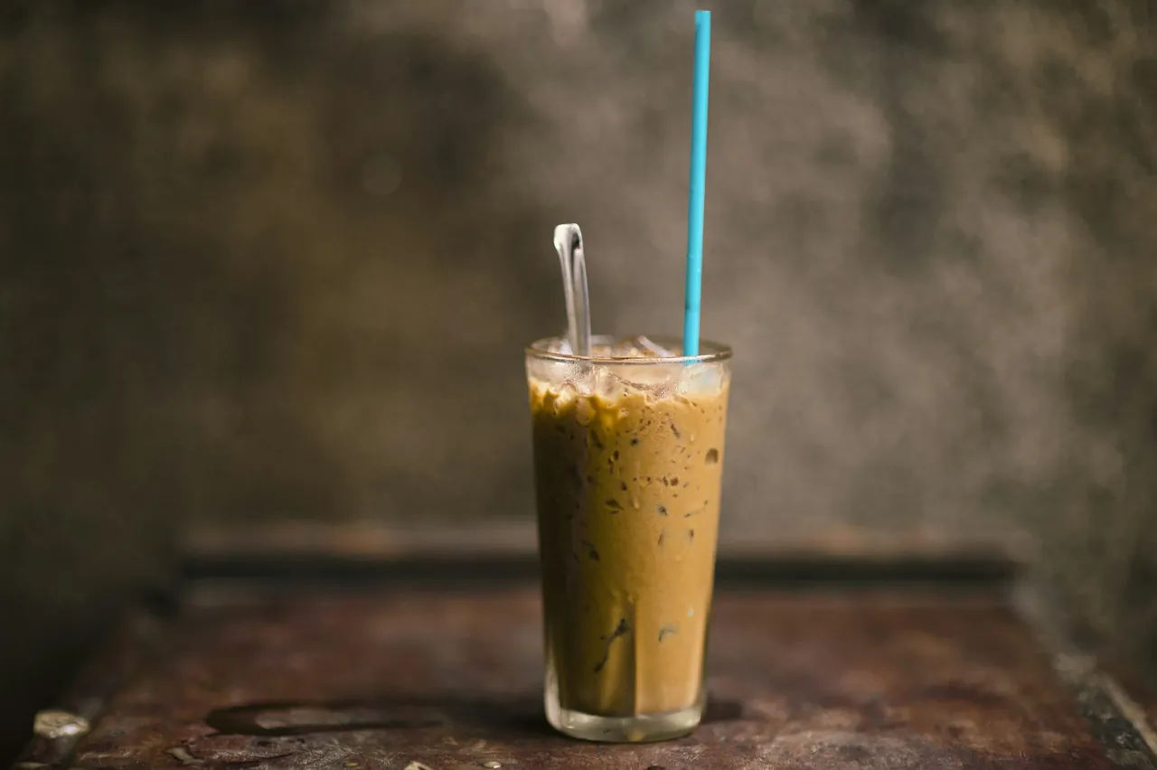 A glass of Vietnamese iced coffee photographed in Vinh Long